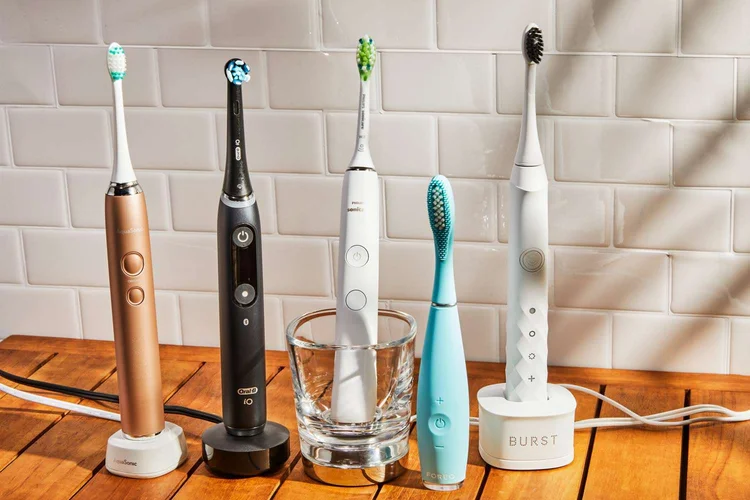 An image of 5 different toothbrushes