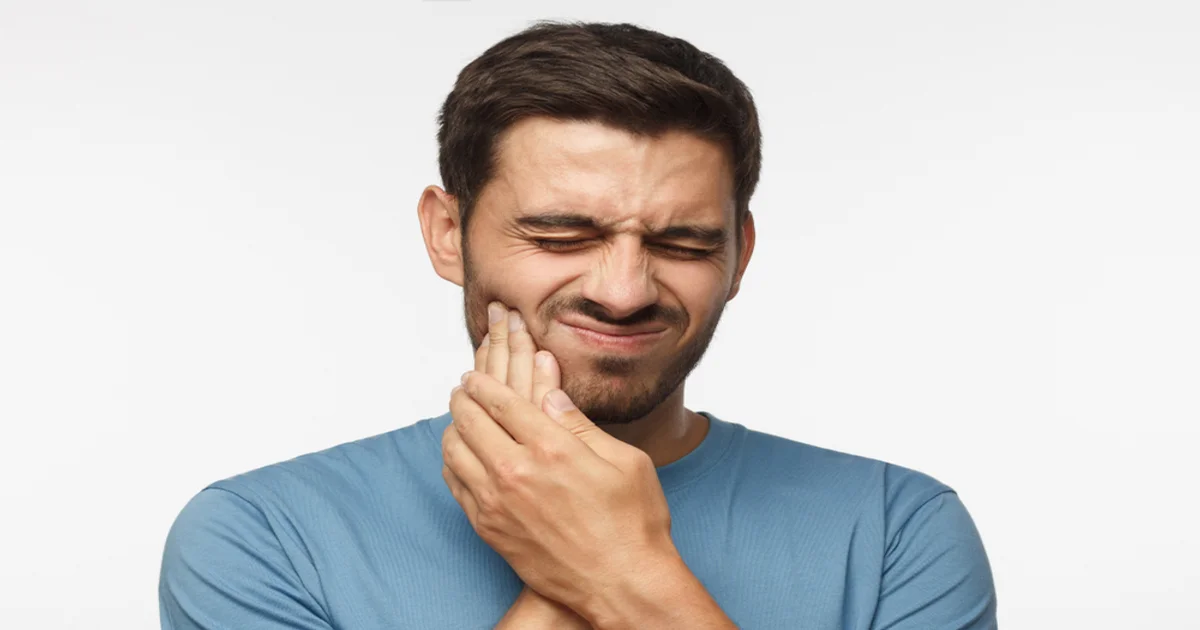 A picture of a man suffering from toothache