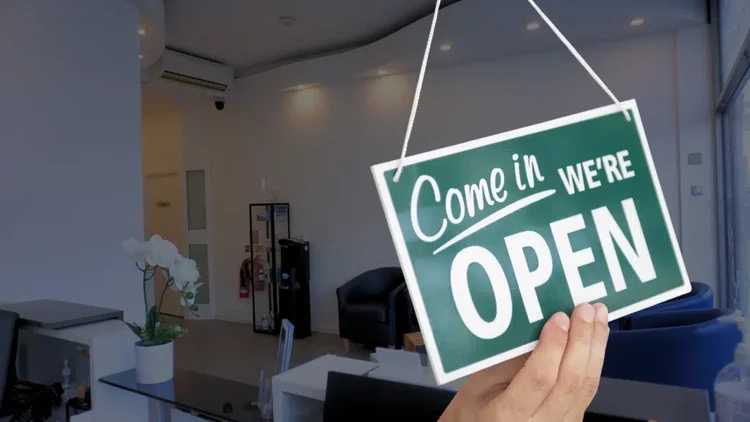 A picture of a dentistry that is open at night