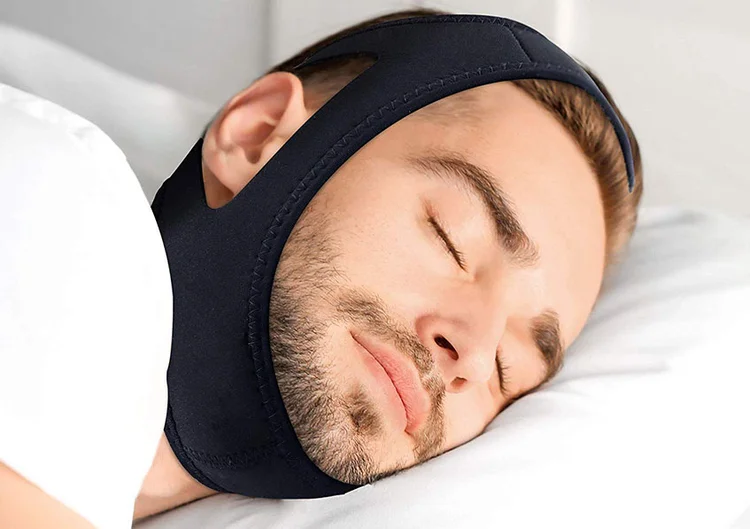 A picture of a young man who is sleeping with severe toothache 